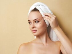 woman-white-towel-applies-serum-face_201606-1644