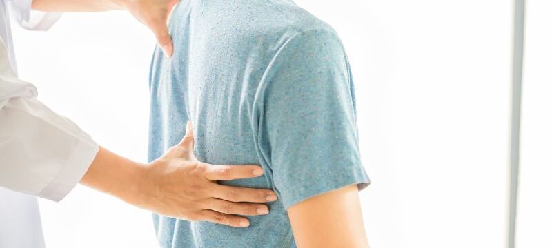 Close up of Physiotherapist working with patient in clinic