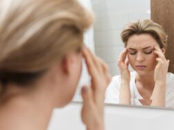 woman-looking-mirror-having-headache