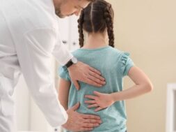 bigstock-Chiropractor-Examining-Child-W-284702701