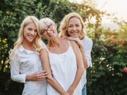 Three women enjoying outdoors, talking and laughing