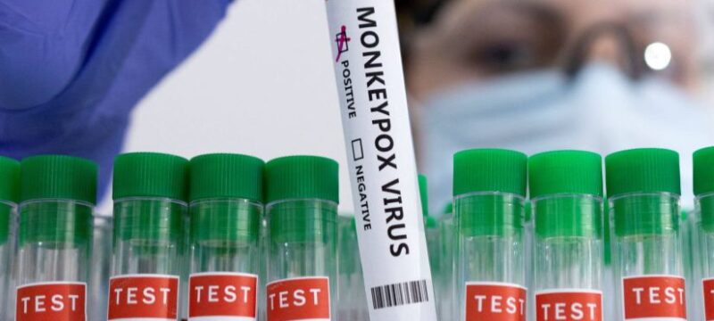 Illustration shows test tubes labelled “Monkeypox virus positive