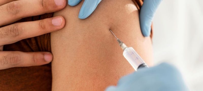 close-up-man-being-vaccinating-by-doctor