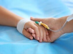 Child,Hand,With,Catheter,On,Bed