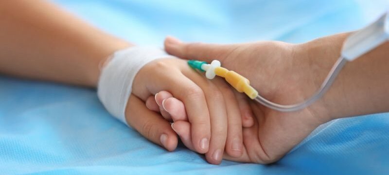 Child,Hand,With,Catheter,On,Bed