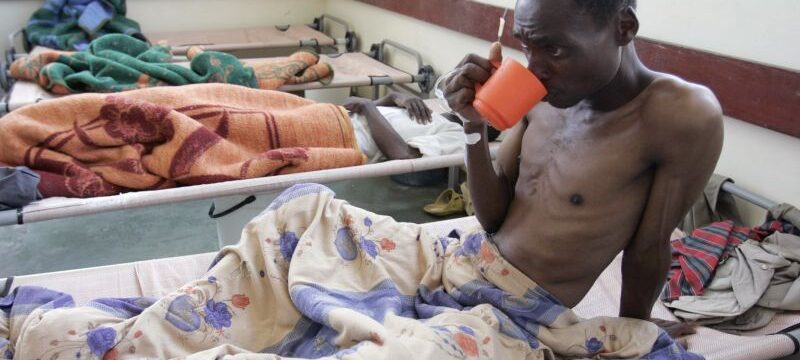 Cholera patient drinks water inside the male ward of Budiriro Polyclinic in Harare