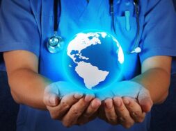 Medical Doctor holding a world globe in his hands as medical net