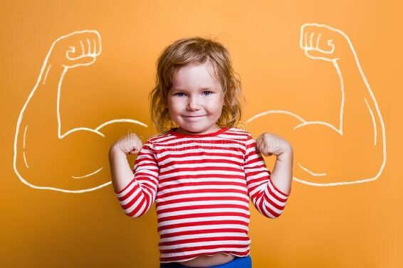 funny-strong-child-muscles-over-yellow-wall-nerd-kindergarten-kid-girl-showing-bicep-muscles-dream-confidence-success-212256163