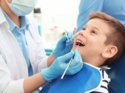 Dentist,Examining,Little,Boy’s,Teeth,In,Clinic