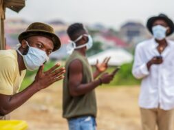 African man wearing face mask for protection,practicing social distance