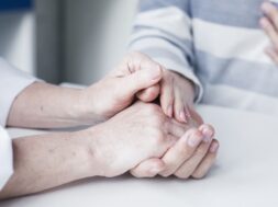 doctor-s-hands-tending-patient