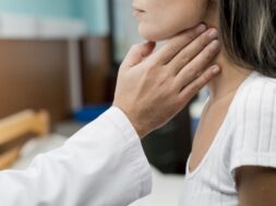 hand-touching-throat-patient