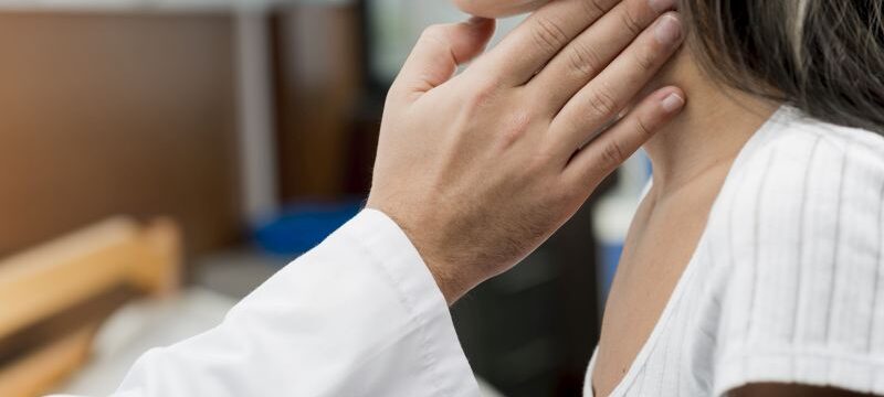 hand-touching-throat-patient