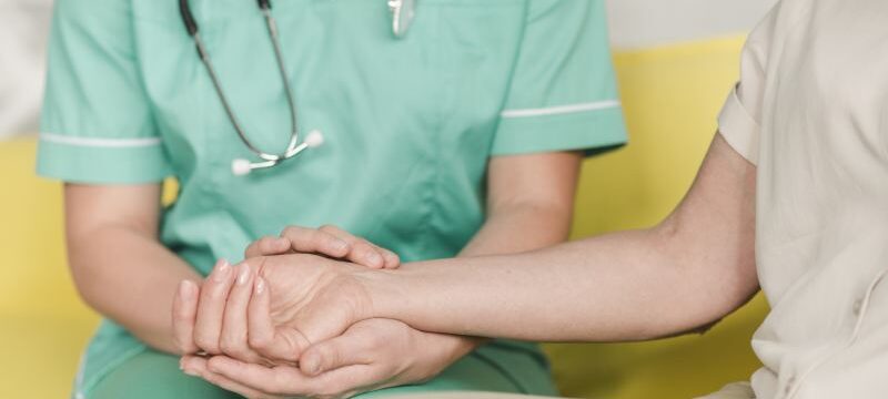 nurse-checking-pulse-female-patient-s-wrist