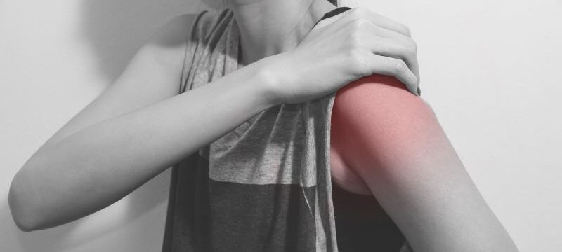 woman shoulder pain, monochrome