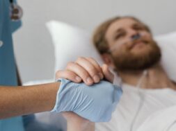 close-up-patient-health-worker-holding-hands