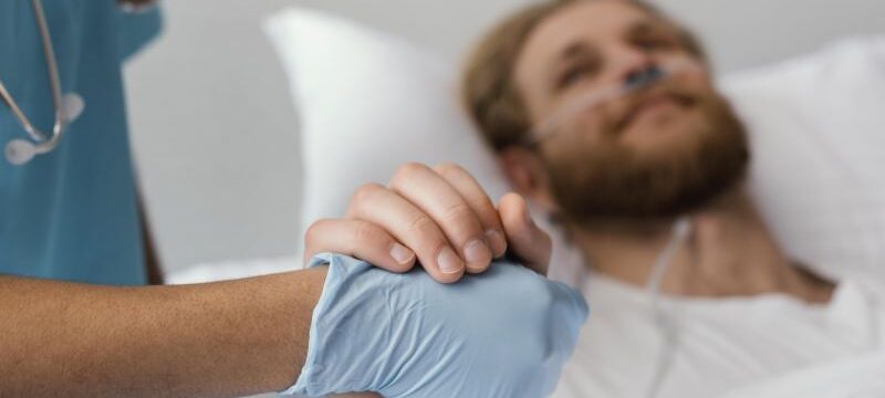 close-up-patient-health-worker-holding-hands