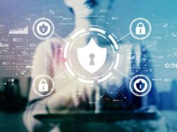 Cyber security theme with businesswoman using a tablet on a city background