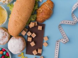 top-view-unhealthy-food-tape-measure