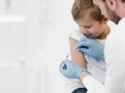close-up-doctor-vaccinating-kid