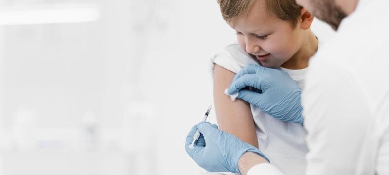 close-up-doctor-vaccinating-kid