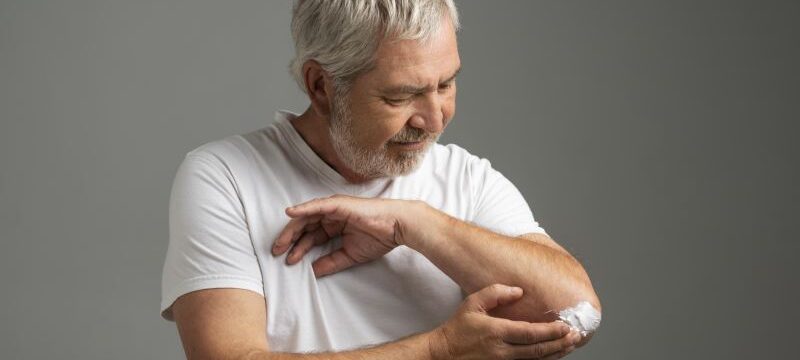 medium-shot-man-using-cream