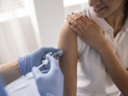 doctor-vaccinating-patient-clinic