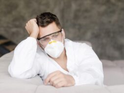 medium-shot-tired-man-with-medical-mask