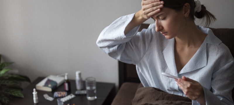 medium-shot-sick-woman-with-fever