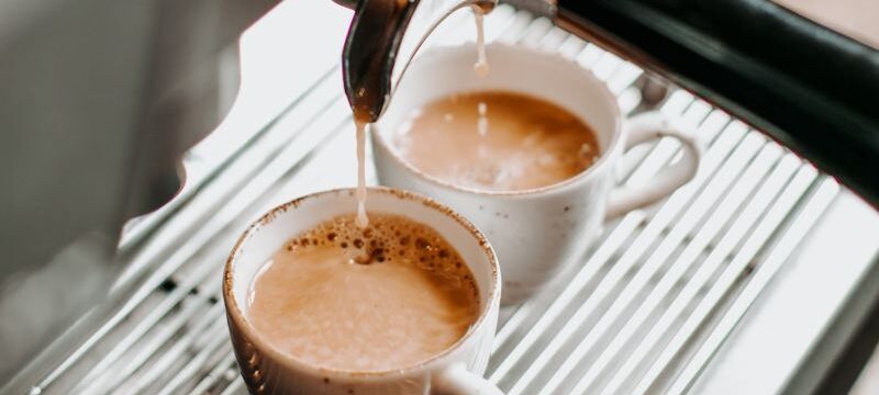 two espresso cups under coffee engine _
