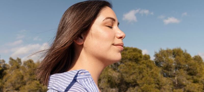 beautiful-woman-enjoying-nature_23-2148931742