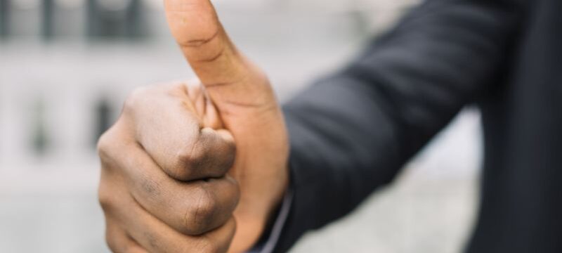 crop-man-gesturing-thumb-up