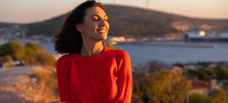 young-woman-red-sweater-magnificent-sunset-mountain_343596-7213