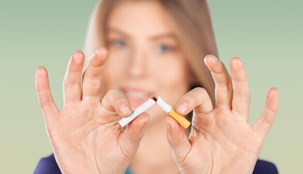 woman-breaking-cigarette-concept-stop-smoking_488220-57853