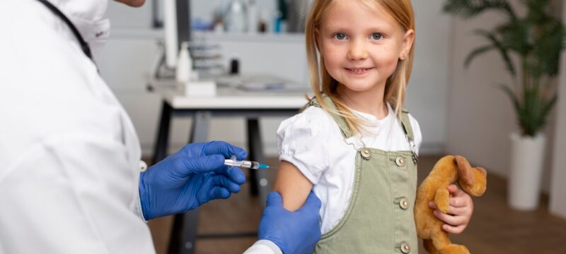 young-girl-getting-vaccine-doctor-s-office_23-2149187464