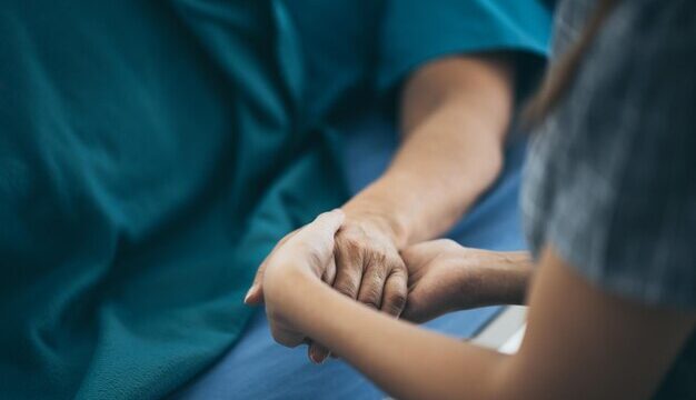 midsection-woman-holding-patient-hand_1048944-20635484