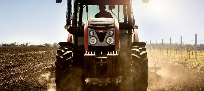 Tractor agricultural machine working in the field.