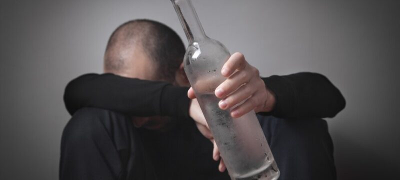 caucasian-alcoholic-man-with-vodka_220873-3377