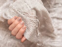 glitter-nail-design-female-hand-with-gray-manicure_127675-2665