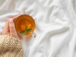 hand-holding-cup-tea-with-mint_23-2148349712
