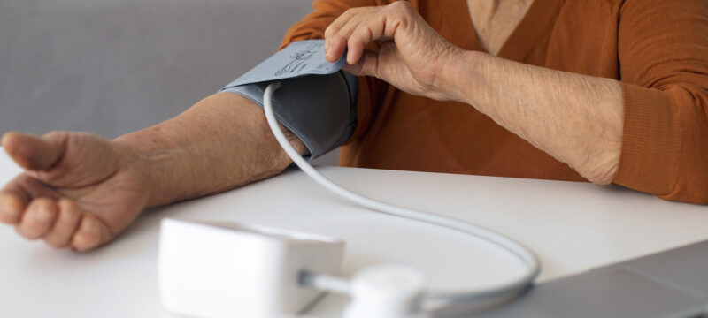 older-person-checking-their-blood-pressure-with-tensiometer