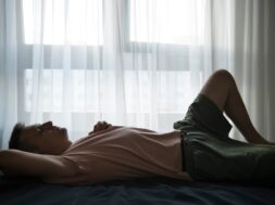 portrait-adult-man-with-curtains-shadow-from-window_23-2149657538