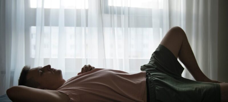 portrait-adult-man-with-curtains-shadow-from-window_23-2149657538