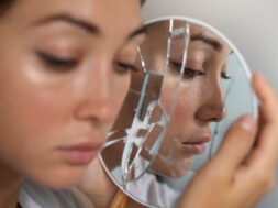 portrait-young-woman-with-low-self-esteem-looking-hand-held-mirror_23-2150038962
