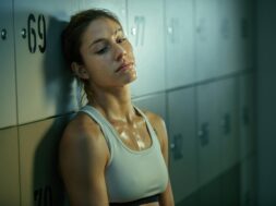 sweaty-sportswoman-feeling-tired-after-workout-relaxing-gym-s-dressing-room-thinking-something_637285-807