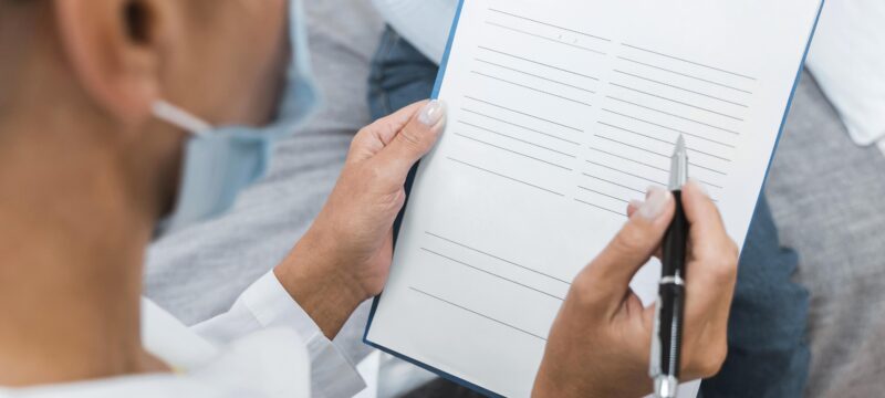 doctor-writing-notes-clipboard