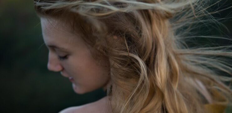 rear-view-young-woman-with-tousled-hair_1048944-13342993
