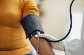 Measuring blood pressure with blood pressure manometer, sphygmomanometer.