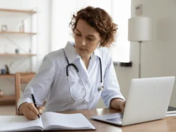 serious-female-doctor-using-laptop-600nw-1720780150