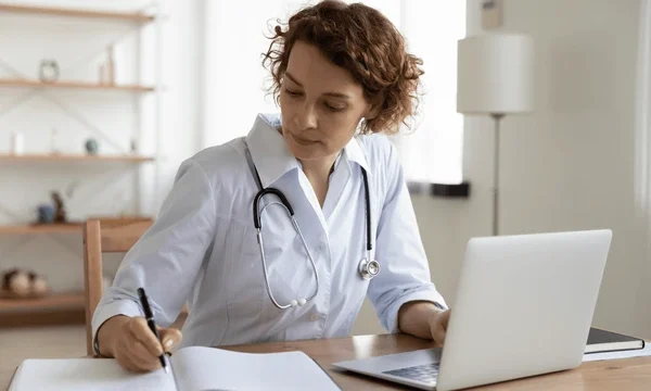 serious-female-doctor-using-laptop-600nw-1720780150